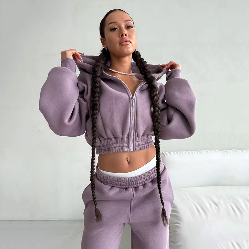 Kvinners sporty fleece jumpsuit med hette og løs passform Skjora