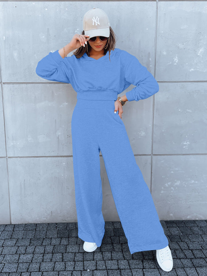 Kvinne casual jumpsuit med vide ben og praktisk hette Skjora
