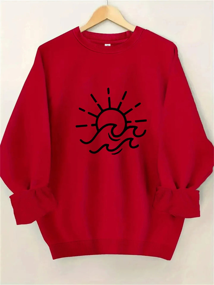 Dame sweatshirt med kreativ sol- og bølgedesign Skjora