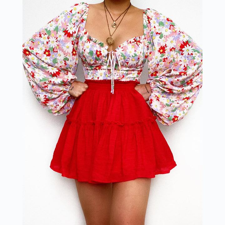 Kvinnebluse med puffærmer og blomstermønster Skjora