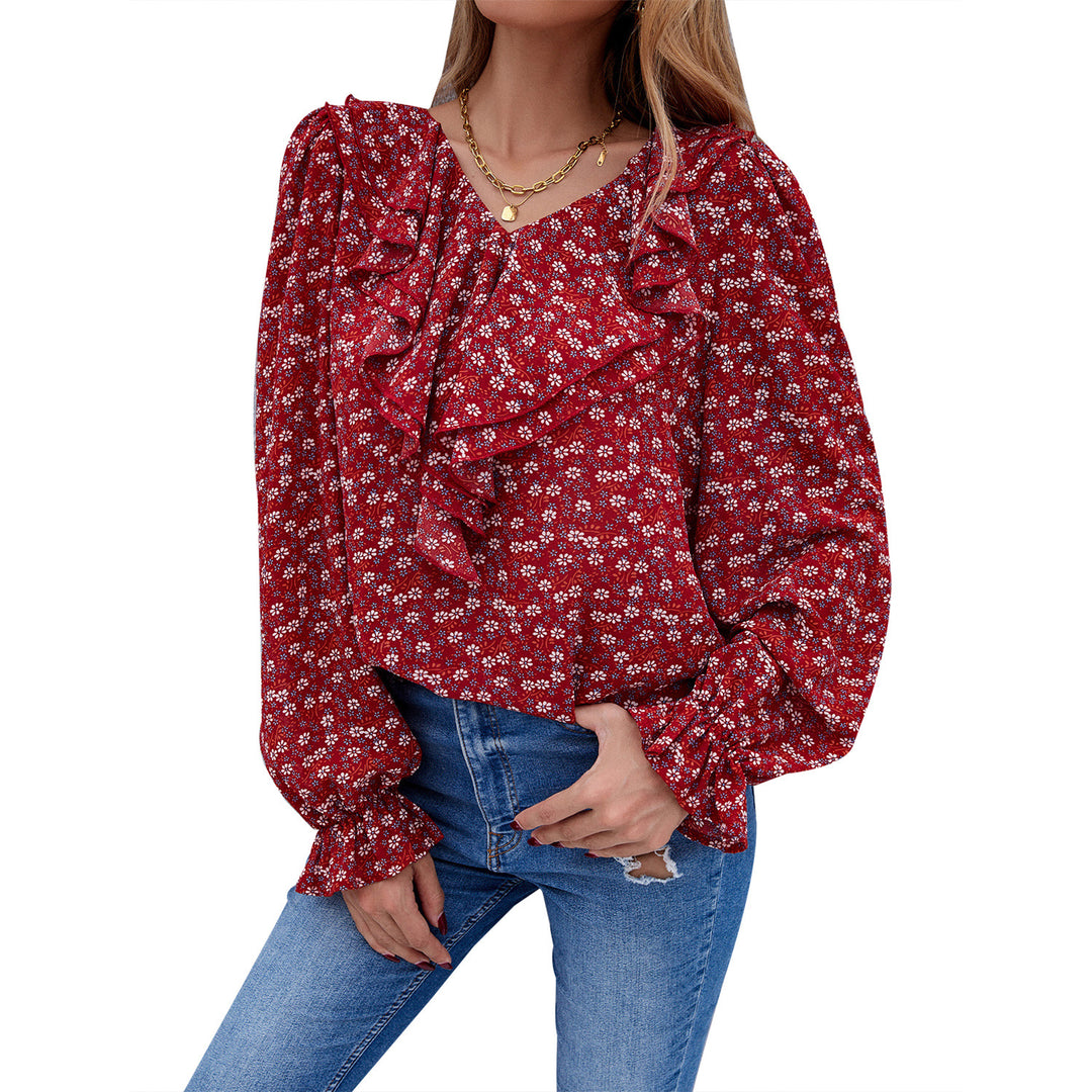 Damebluse med ruffledetaljer og blomstermønster Skjora