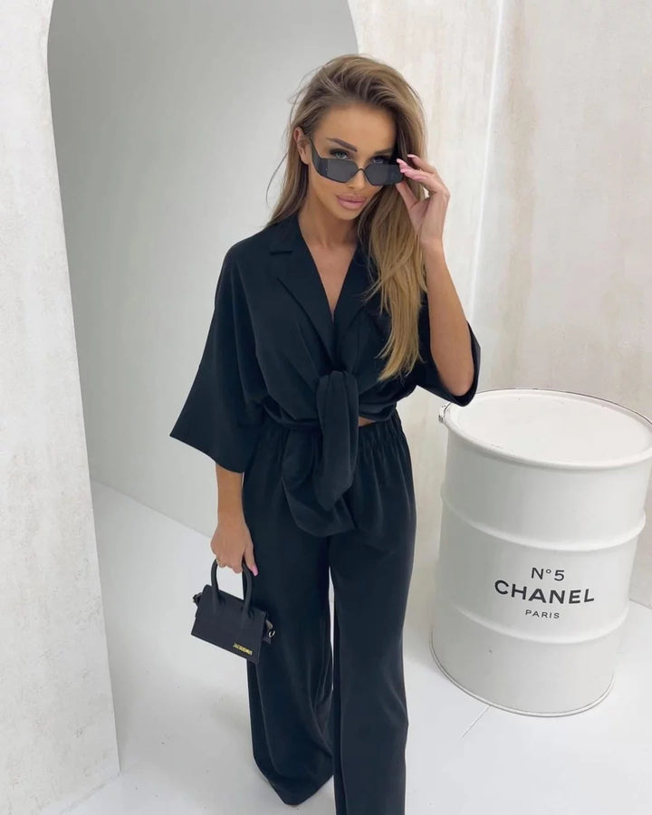 Kvinnelig elegant omslags jumpsuit med knappedetaljer Skjora