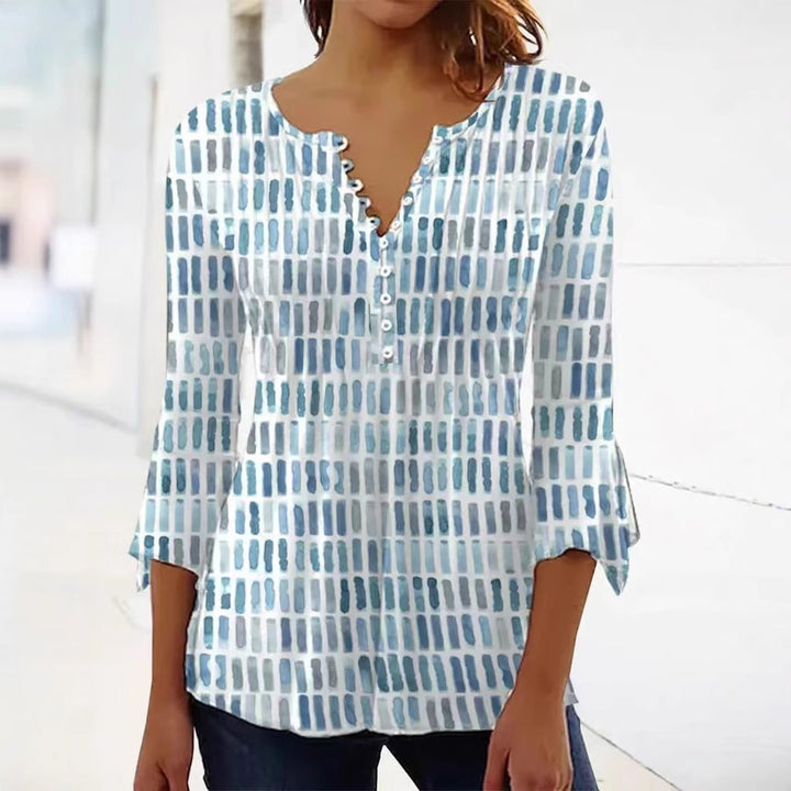 Damebluse i moderne grafisk design med knappe detaljer Skjora