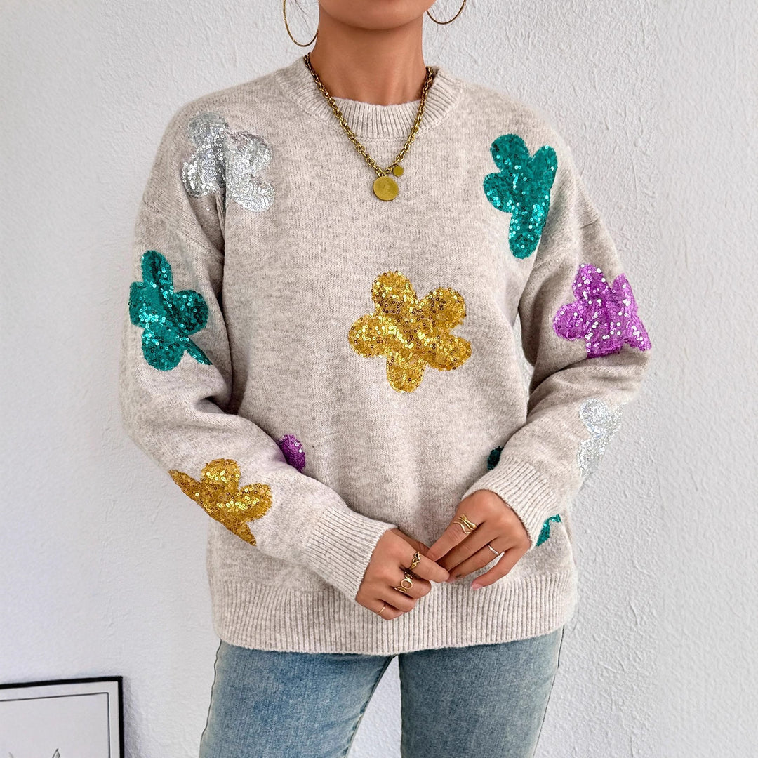 Kvinnes glitrende oversized genser med blomstermotiv Skjora