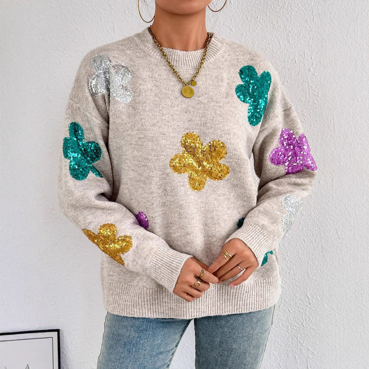 Kvinnes glitrende oversized genser med blomstermotiv Skjora