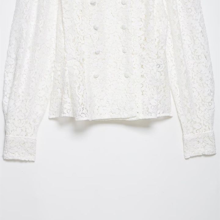 Dame spissbluse med dekorative knapper og elegant passform Skjora