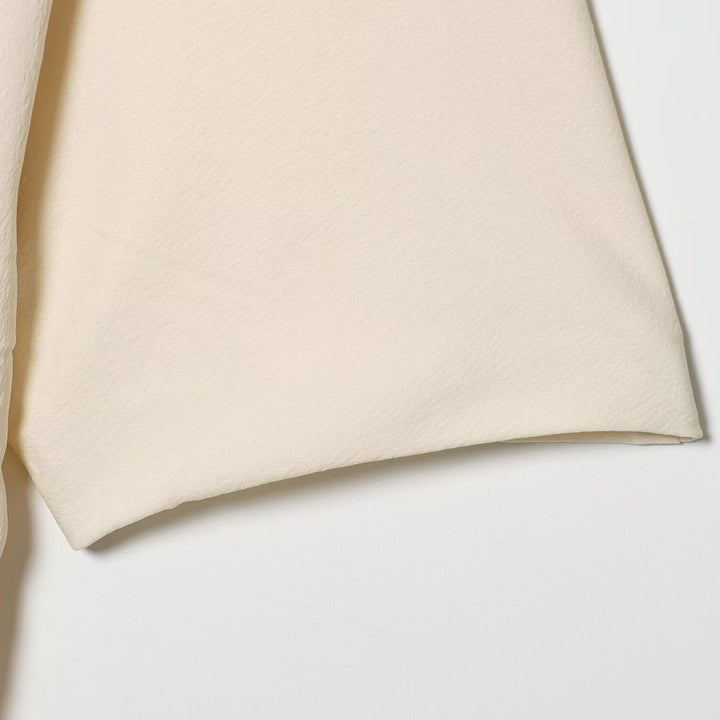 Damen asymmetrisk topp med elegant drapering Skjora