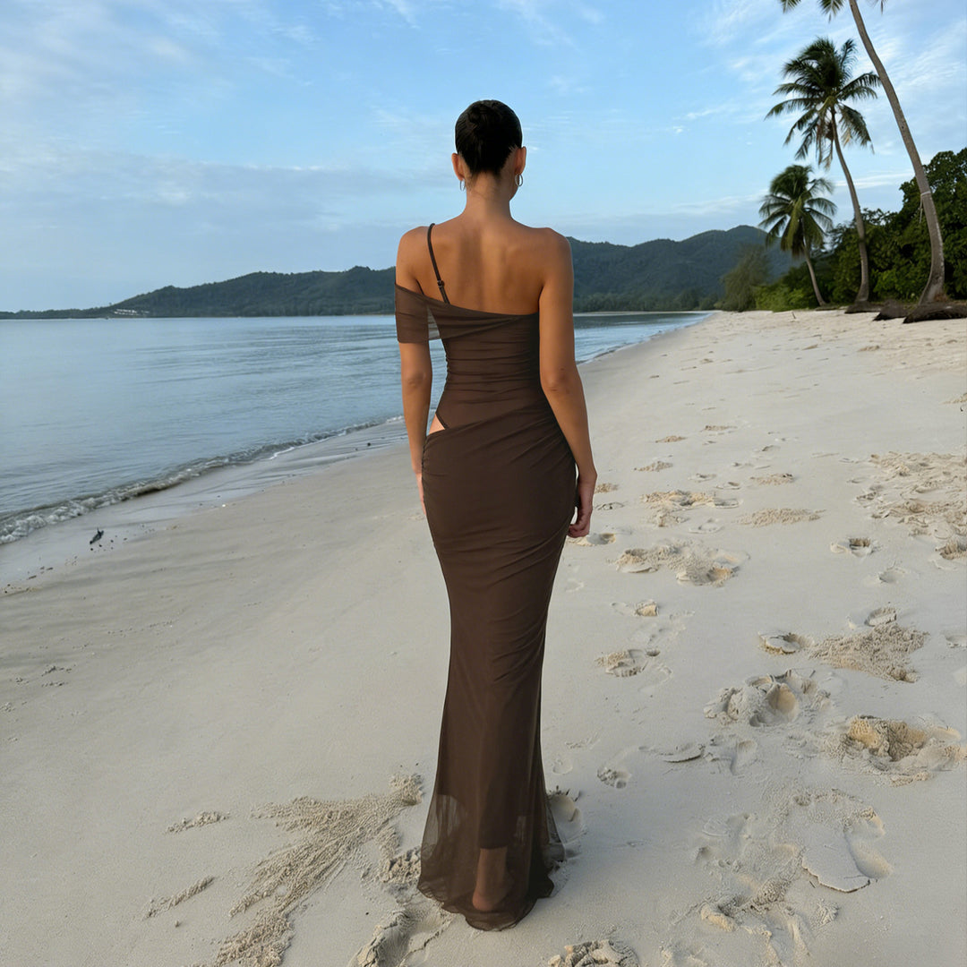 Elegant women's evening dress with refined ruffle details and transparent inserts Skjora
