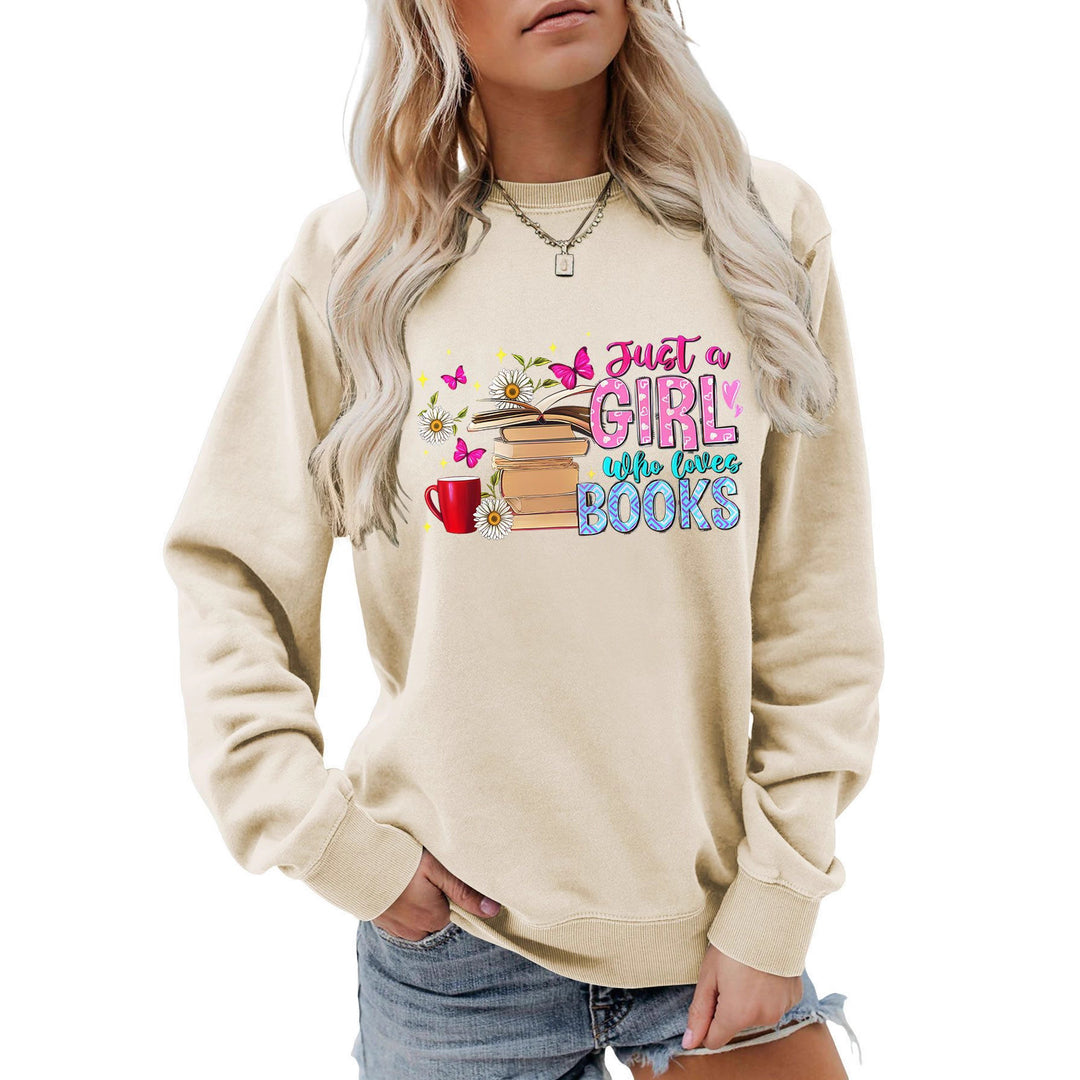 Dame sweatshirt med iøynefallende bokmotiv og ledig passform Skjora