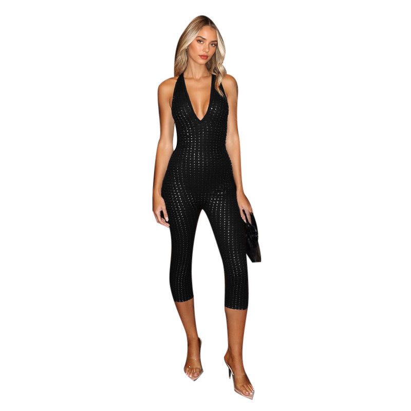 Dame figurvennende Jumpsuit med dyp V-hals og nettaktig design Skjora