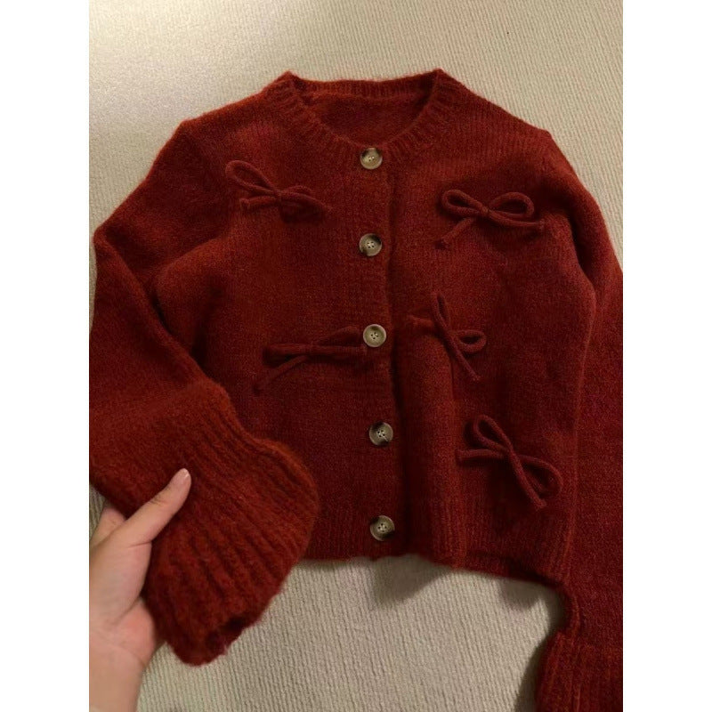 Dame cardigan med dekorative sløyfer på