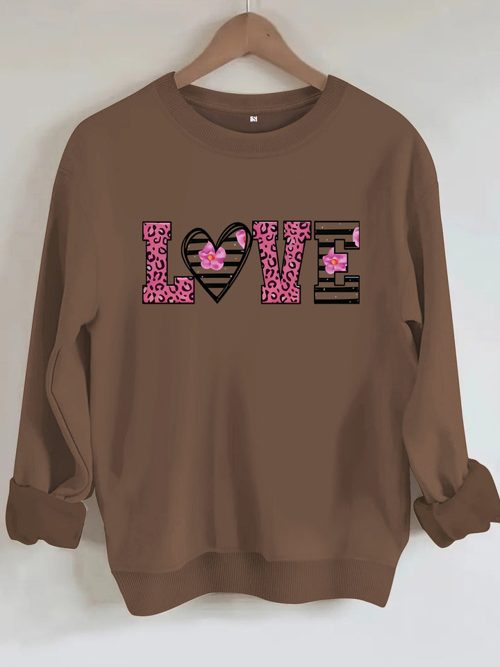 Dame sweatshirt med moderne leopard hjerte-design og behagelig passform Skjora