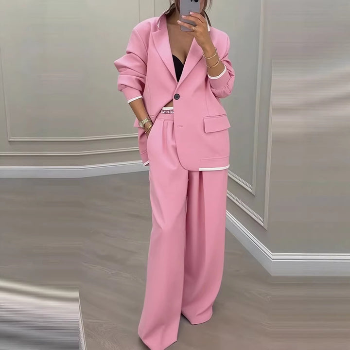 Kvinnes moderne oversized blazer sett med elegante dressbukser Skjora