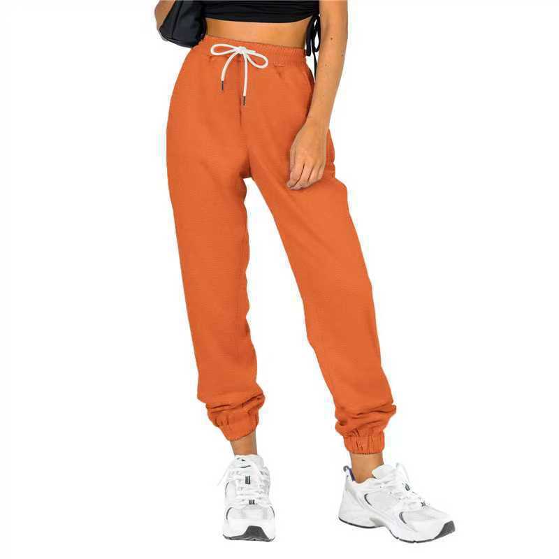 Kvinne sporty joggebukser med praktisk snor og elastisk liv.