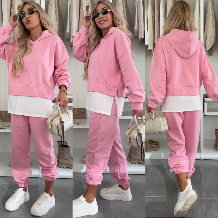 Kvinnelig sporty og moteriktig hettegenser sett med cropped snitt og komfortable bukser Skjora