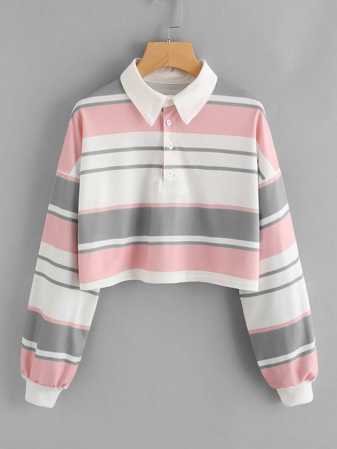 Dame polo skjorte i en avslappet crop design med et stilfullt fargeblokk mønster Skjora