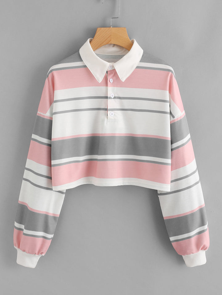 Dame polo skjorte i en avslappet crop design med et stilfullt fargeblokk mønster Skjora