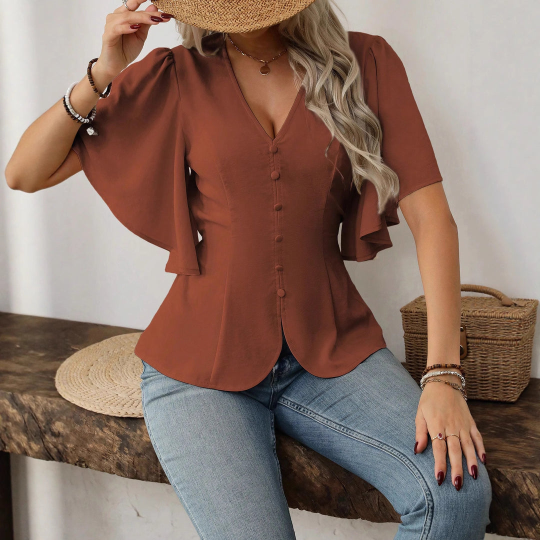Dame elegant bluse med klokkeermer og knappdetalj Skjora
