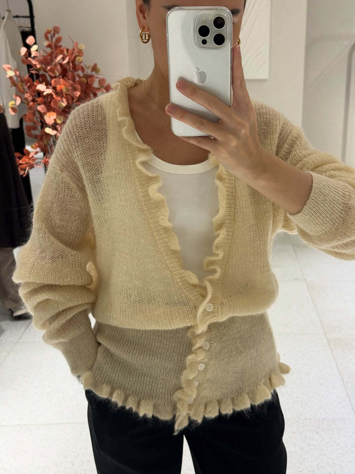 Dame cardigan med lekent volangdesign Skjora