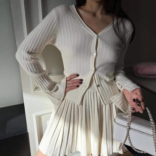 Dame cardigan med fint ribbmønster og ermeknapp Skjora