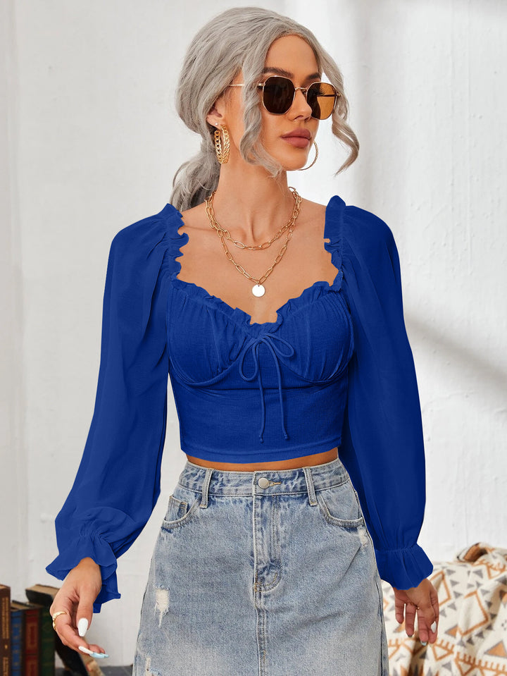Dame Cropped-bluse med volanger og elegante puff-ermer Skjora
