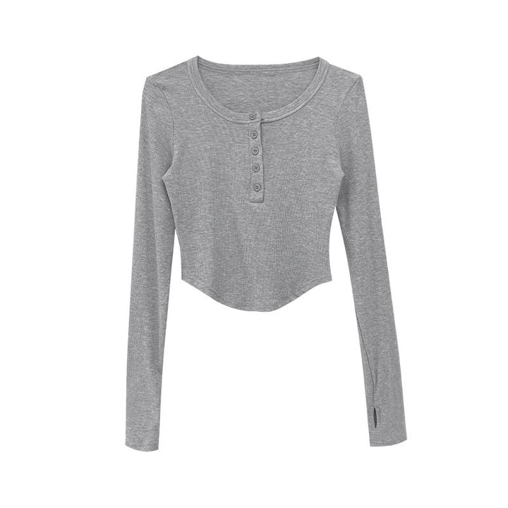 Kvinneshirt med lange ermer og dekorativ knappedesign og avslappet passform