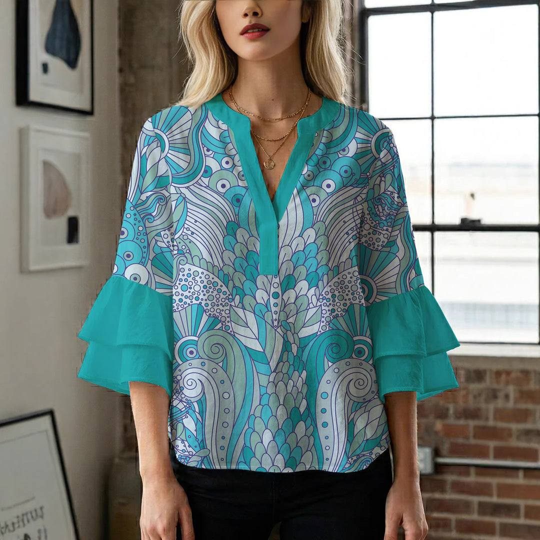 Damebluse med voluminøse puffermer og kreativt blomstermønster Skjora