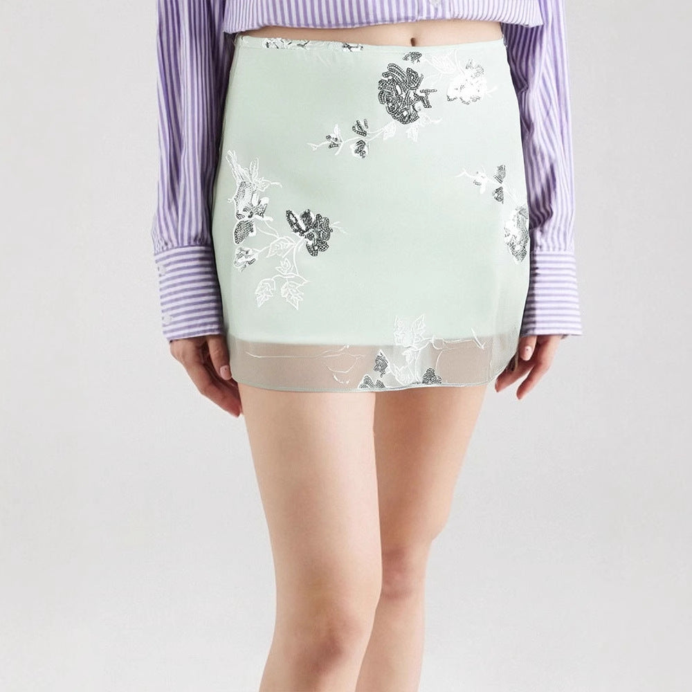 Dame gjennomsiktig skjørt med floralt design og glitrende detaljer Skjora