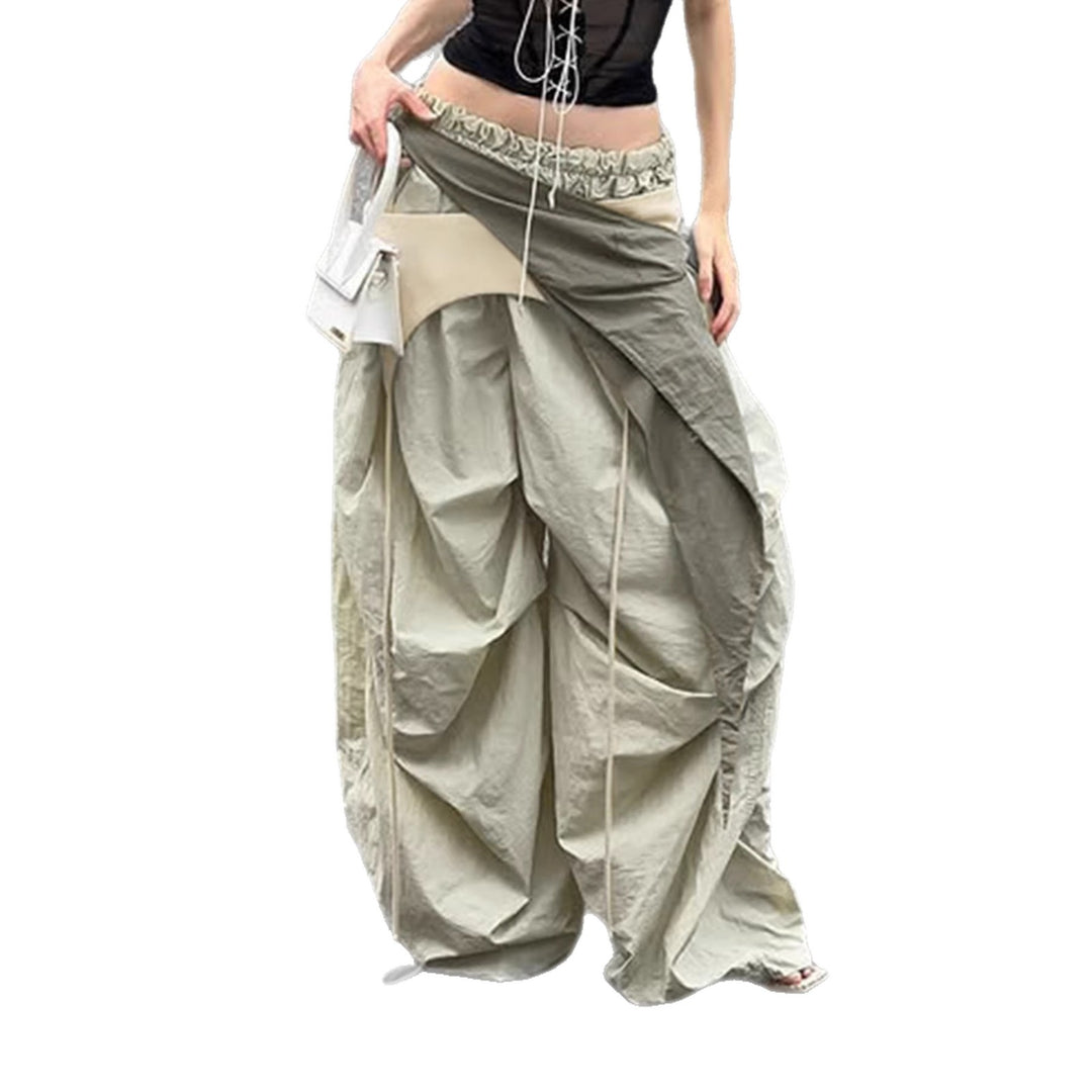 Dame modische High-Waist-bukse med asymmetrisk design og sidelivsnedbinding Skjora