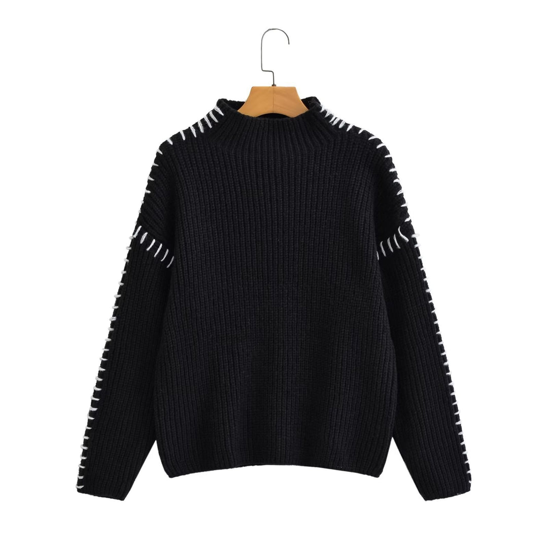 Kvinne chunky strikkegenser med høy krage og elegante erme detaljer Skjora