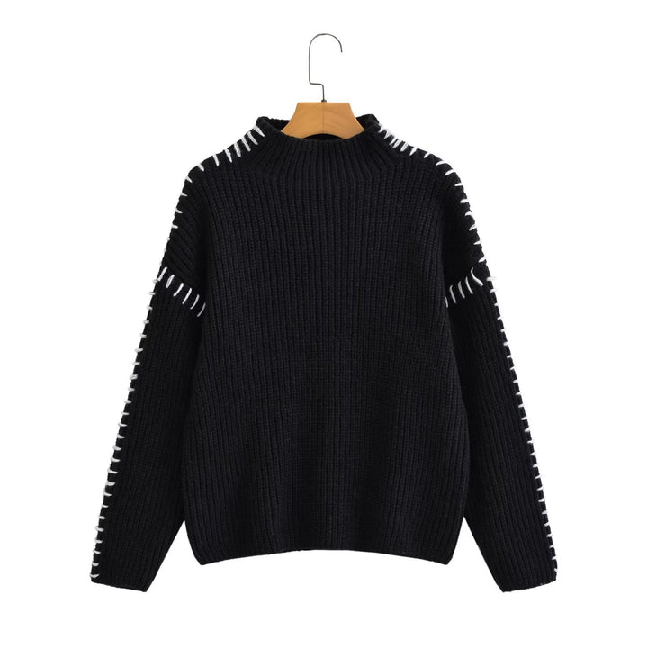 Kvinne chunky strikkegenser med høy krage og elegante erme detaljer Skjora