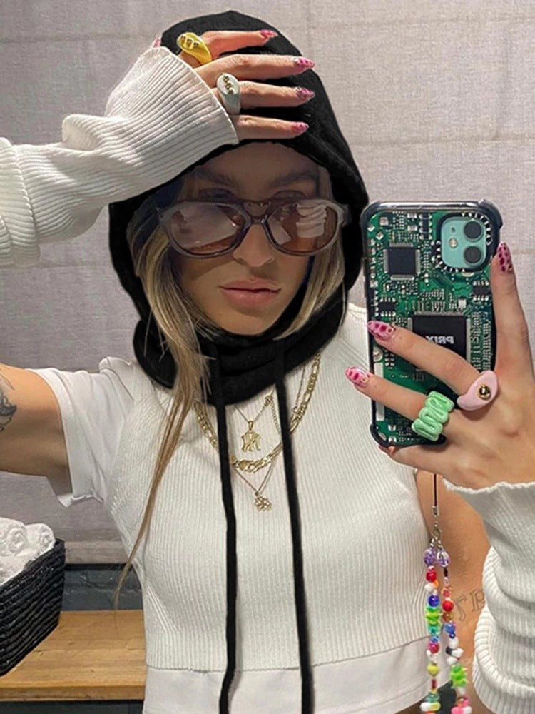 Ladies fashionably knitted top with hood and long sleeves Skjora