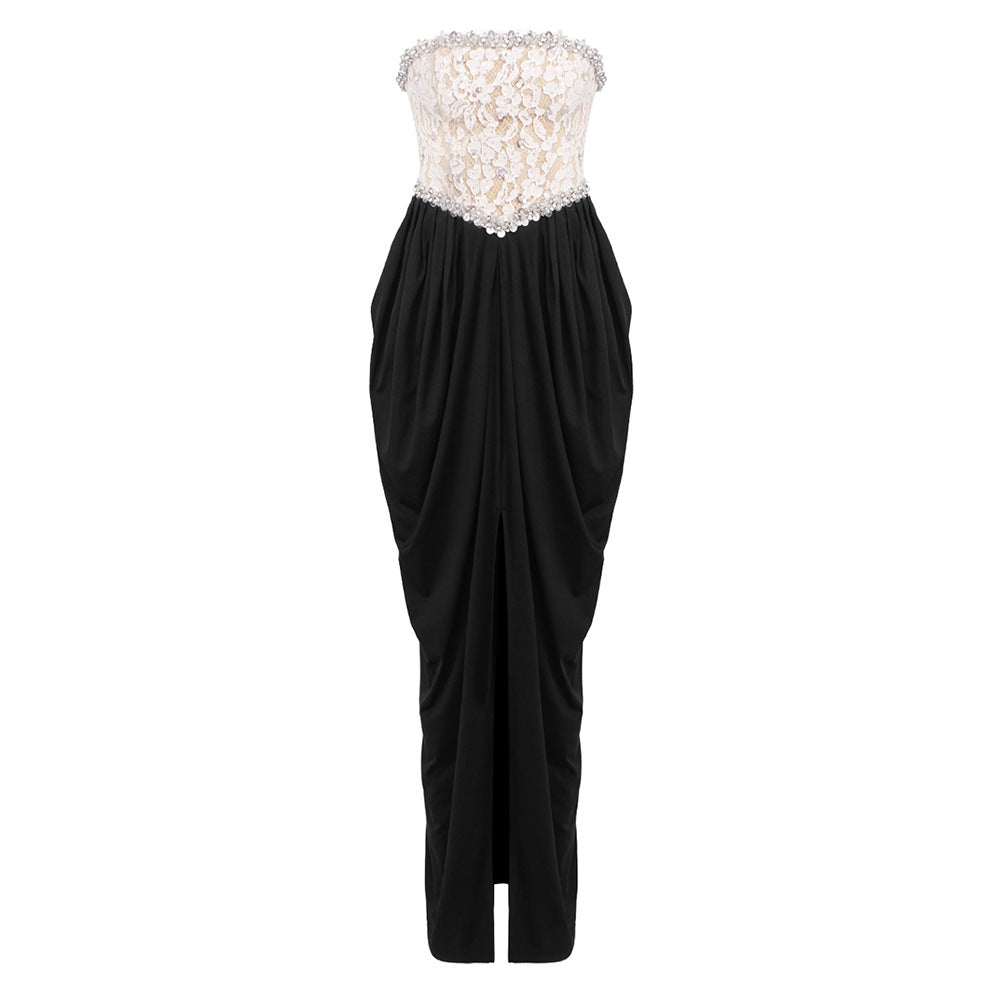 Women's elegant evening dress with glittery pointed top and draped skirt