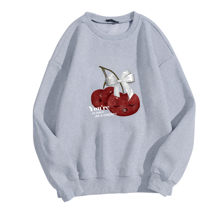 Kvinne komfortabel sweatshirt med fruktig kirsebærmotiv Skjora