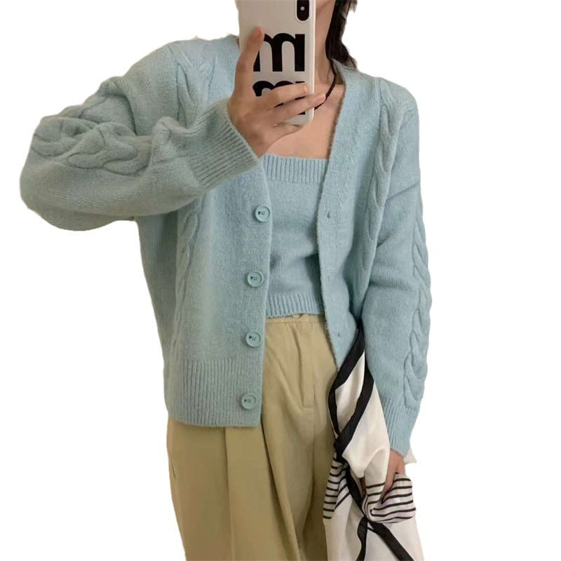 Dame cardigan i kabelstrikkdesign med knappestolpe og elegant passform Skjora