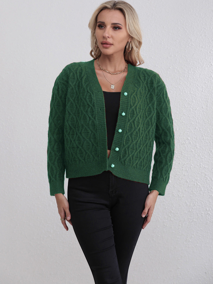 Women's designer cardigan with cable pattern and soft colors Skjora