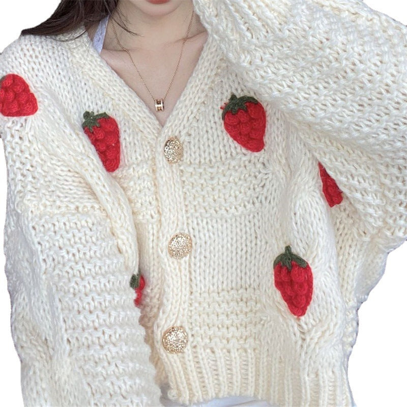 Kvinnest chunky strikk cardigan med nydelige blomsterapplikasjoner og gullknapper Skjora