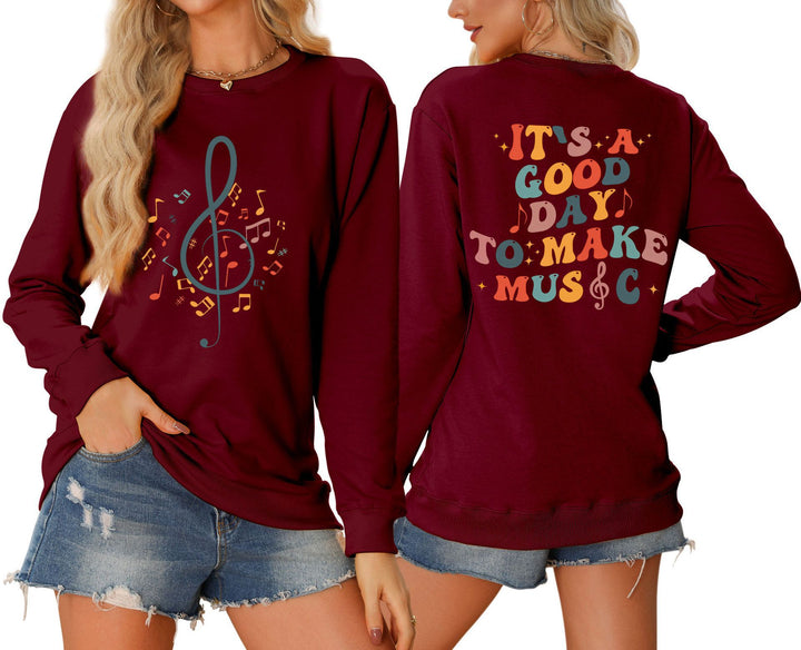 Dame sweatshirt med musikalsk motiv og kreativ skrift Skjora