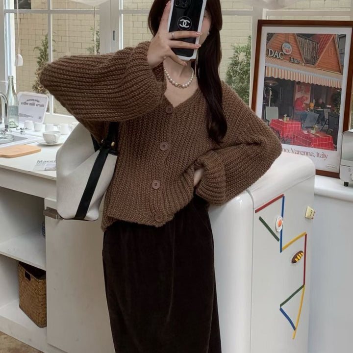 Dame cardigan med overdimensjonerte ermer og knappdetalj Skjora