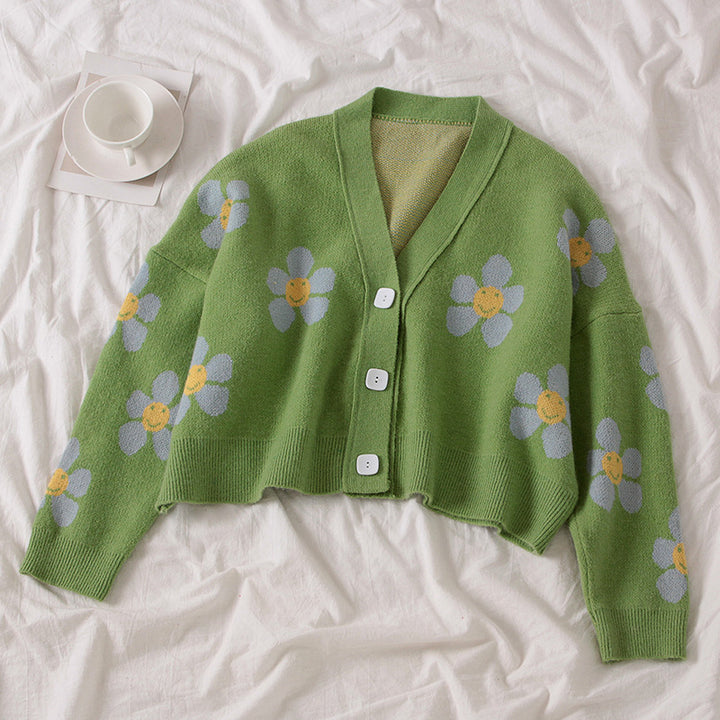 Kvinnes chunky strikk cardigan med blomstermønster og knappedetaljer Skjora