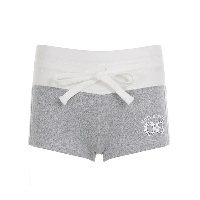 Dame fritidshorts med elastisk midje og dekorativt belte Skjora