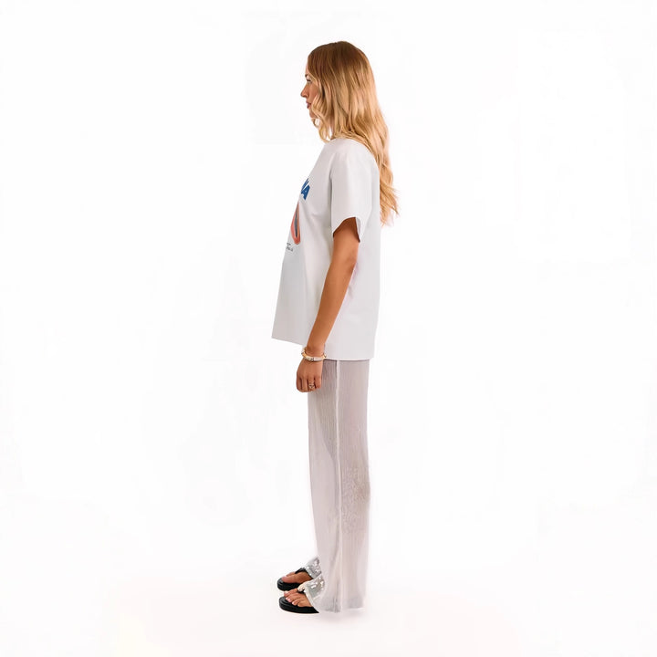 Kvinnelige elegante paljettbukser med gjennomsiktig chiffon og vid cut Skjora