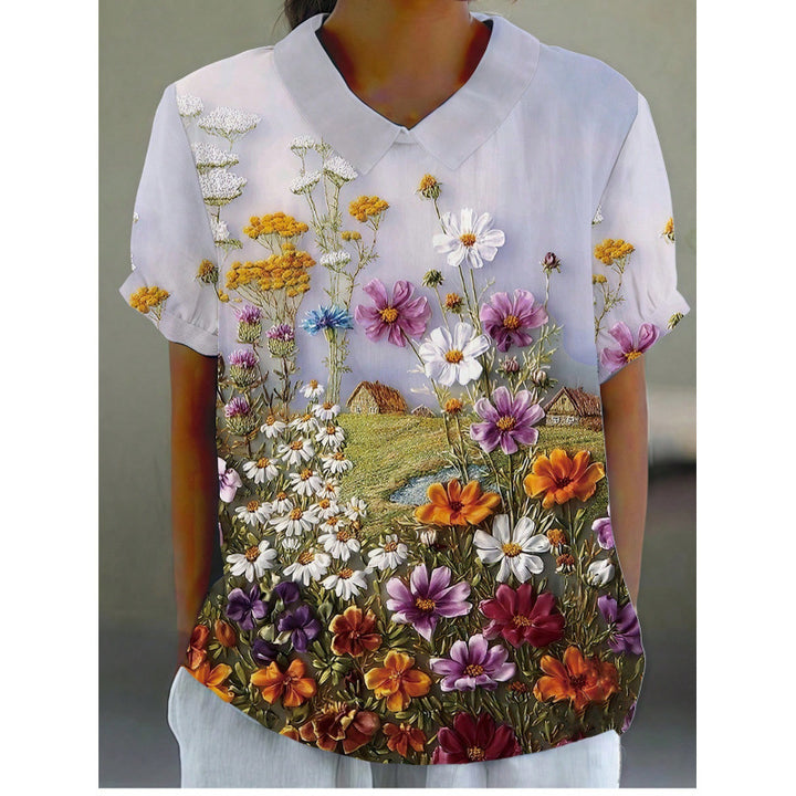 Dame kortermet bluse med florale accenter og klassisk krage Skjora