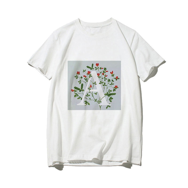 Dame T-skjorte med blomsterdesign og kreativt trykk Skjora
