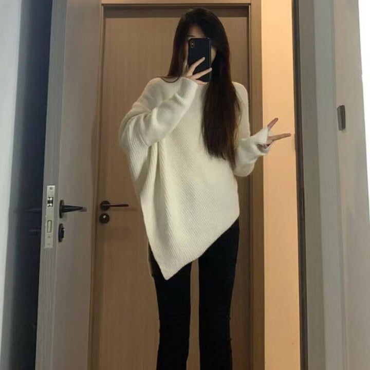 Kvinnes oversized strikket genser med asymmetrisk kutt og fin ribbestruktur Skjora