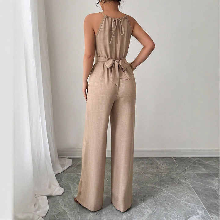 Dame gulvlengde jumpsuit med raffinert omslagdesign og elegant midjebånd Skjora