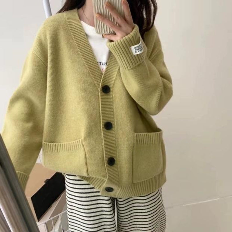 Damenes uformelle oversized cardigan med store lommer og knappdetaljer Skjora