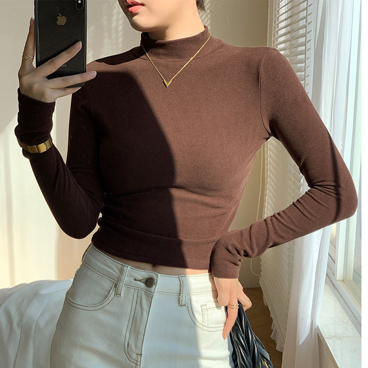 Kvinners langermet crop top med høy krage og tettsittende snitt