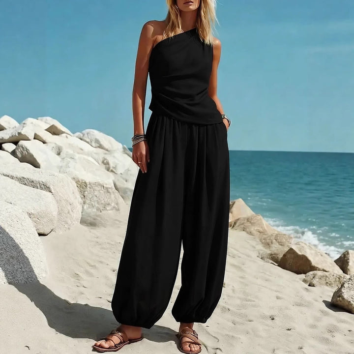 Damer Elegant Einteiler-Outfit med Flytende Snitt og One-Shoulder-Design Skjora