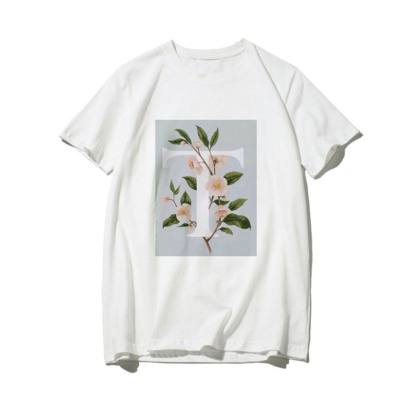 Dame T-skjorte med blomsterdesign og kreativt trykk Skjora